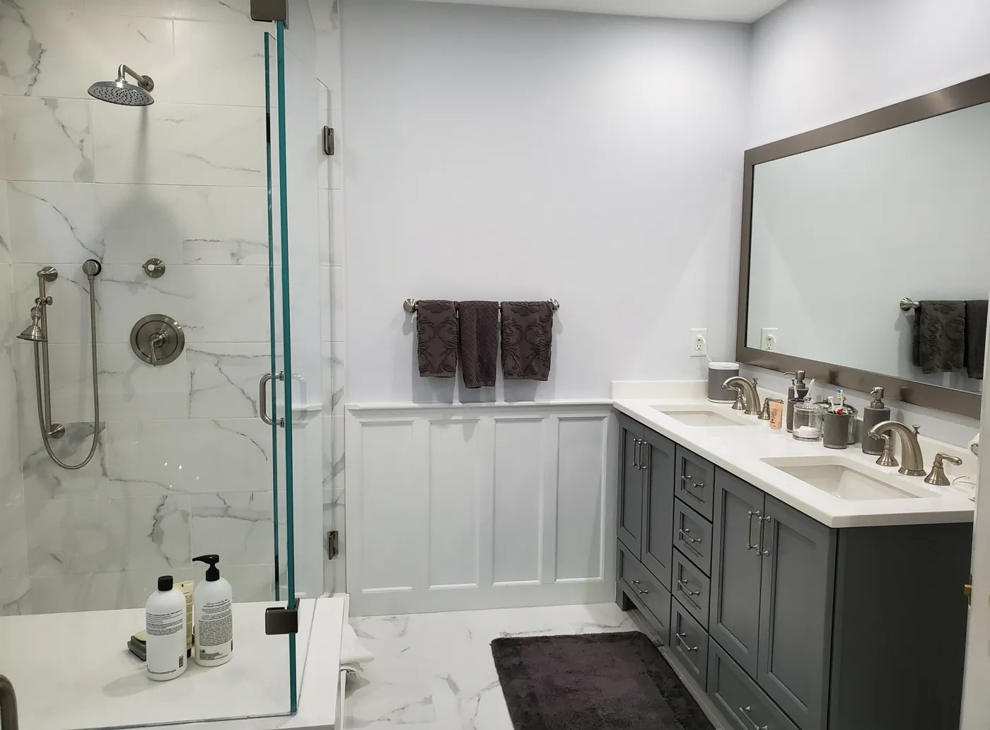 Bathroom with glass shower and double vanity
